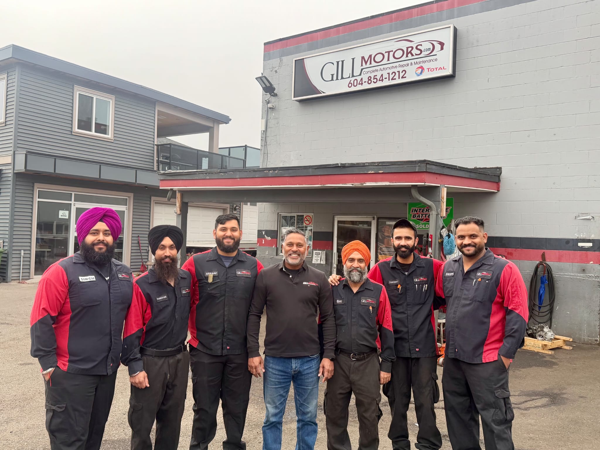 The Gill Motors team outside the Windsor Street shop
