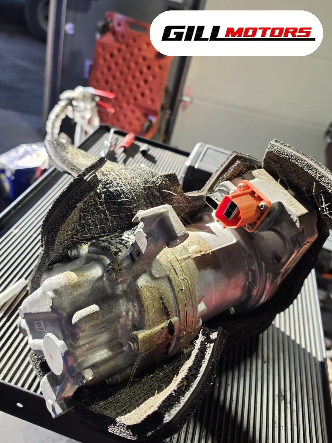 Tesla heat pump repair work shared by Gill Motors on Instagram